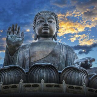 Golden Lotus Serenity: Meditating Buddha Rock Carving