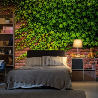 Red Brick Wall With Green Hanging Leaves Mural Wallpaper