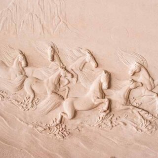 Running Horses Sculpted on Walls Wallpaper Mural