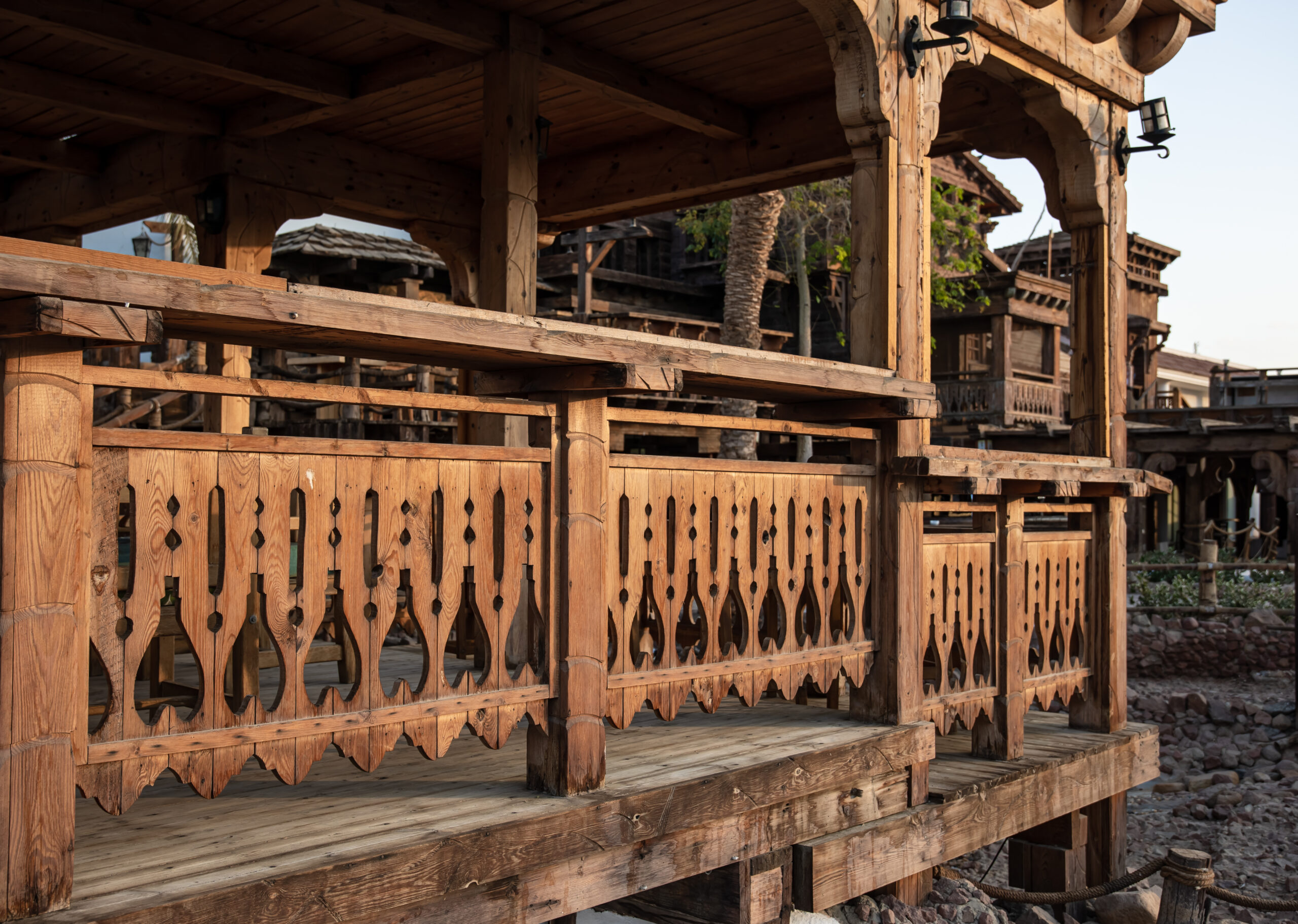 Wooden carved railing of a large wooden house.