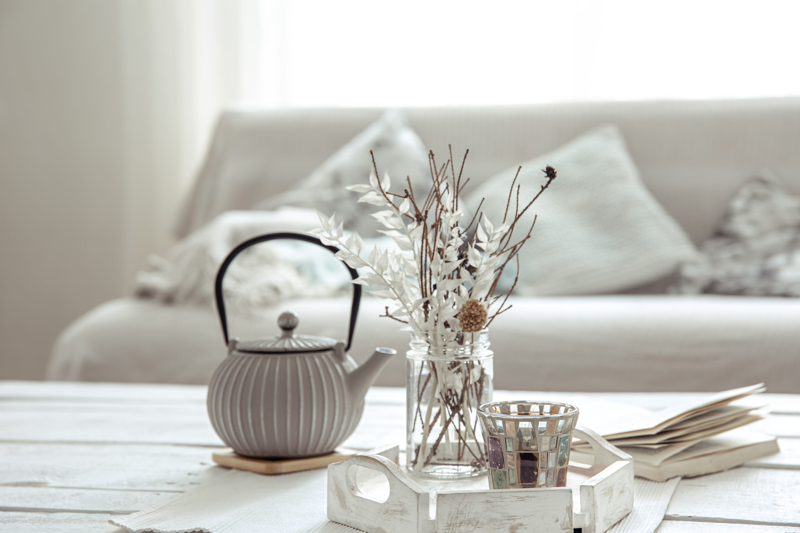 Home arrangement with teapot and Scandinavian decor details.
