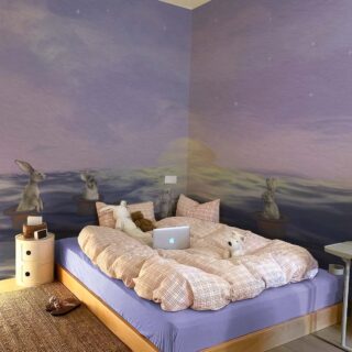 Echoes Edo, Dreamy Bunnies Adrift in Magic Hats on a Starlit Sea Wallpaper Mural mockup