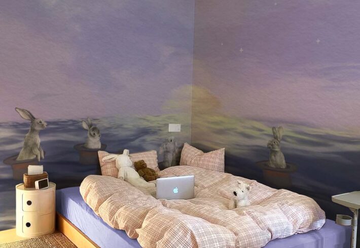 Echoes Edo, Dreamy Bunnies Adrift in Magic Hats on a Starlit Sea Wallpaper Mural mockup