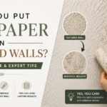 Wallpaper installation on a textured wall with before-and-after comparison.
